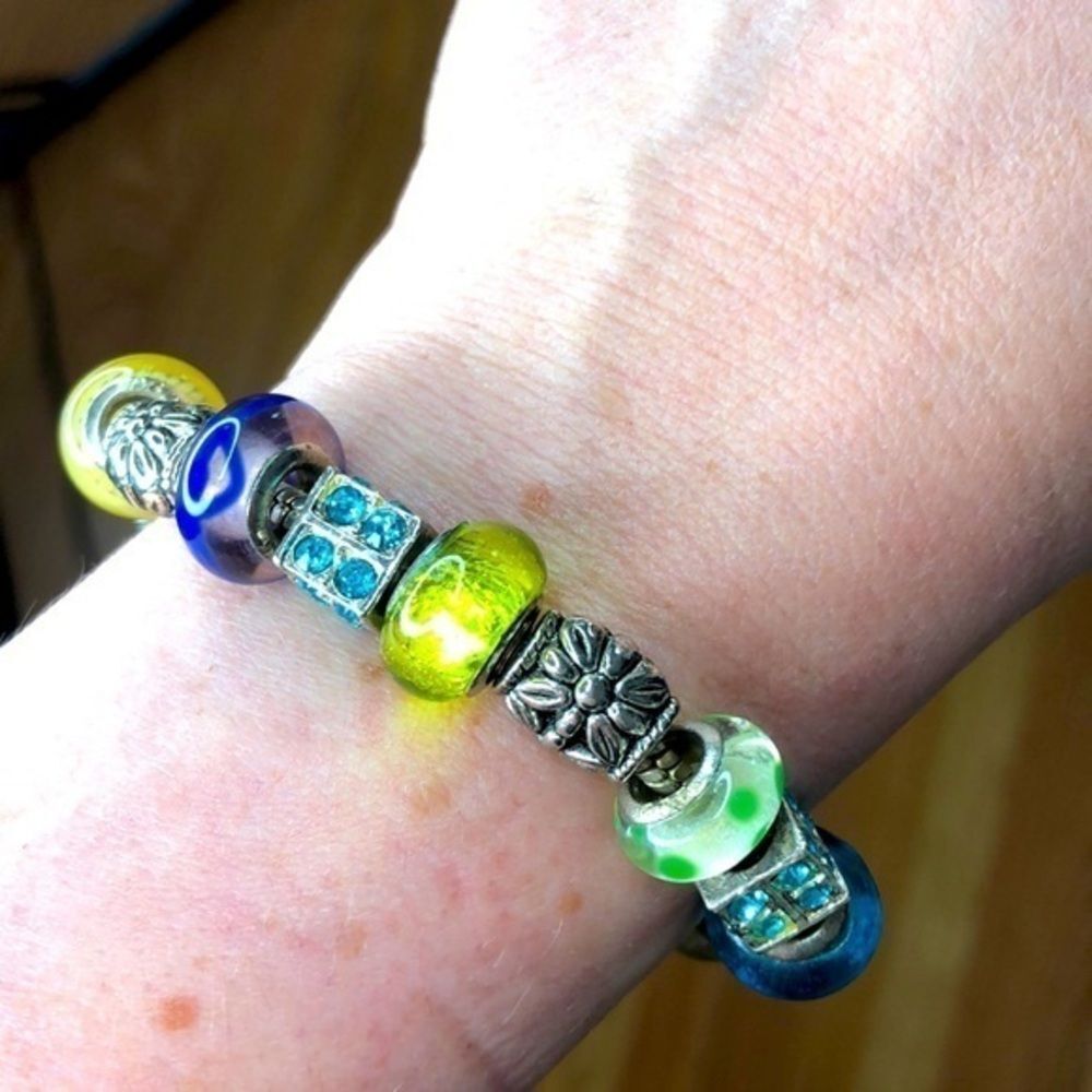 Charm bracelet with glass beads.